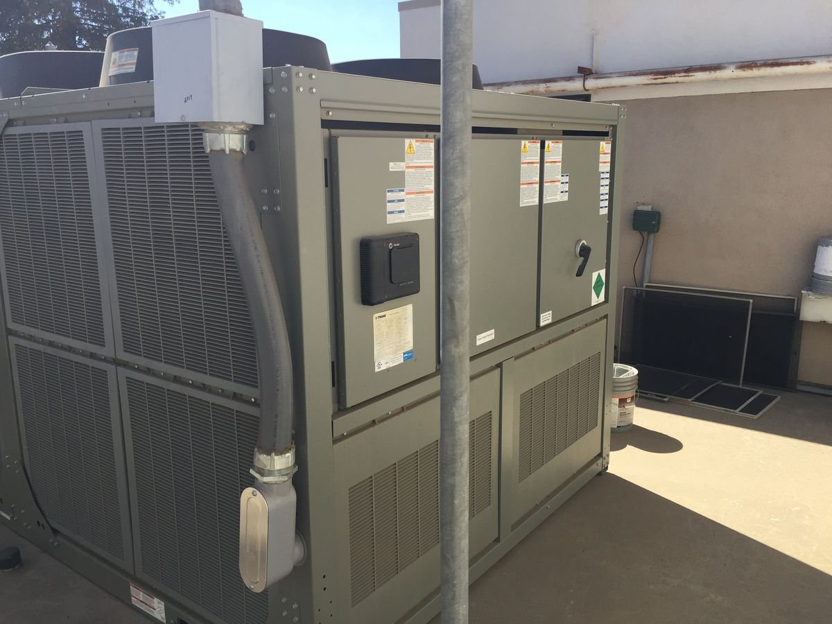 Air-cooled chiller unit outside a commercial facility